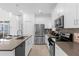 Modern kitchen with stainless steel appliances and ample counter space at 8940 Play Through Dr, Davenport, FL 33896