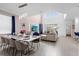 Spacious living room with high ceilings, a large TV, and comfortable seating at 8940 Play Through Dr, Davenport, FL 33896