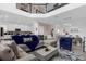 Open concept living area showcasing a sectional sofa, dining area, and kitchen at 8940 Play Through Dr, Davenport, FL 33896