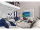 Open concept living room with high ceilings, a large TV, and comfortable seating at 8940 Play Through Dr, Davenport, FL 33896