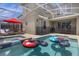 Private screened-in pool and spa with lounge chairs at 8940 Play Through Dr, Davenport, FL 33896
