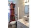 Clean bathroom with a vanity, toilet, and shower/tub combo at 1111 South St, Eustis, FL 32726