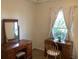 Bedroom with vanity, desk, and chair, offering ample workspace at 1111 South St, Eustis, FL 32726