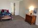 Bedroom with twin bed, dresser, and access to hallway at 1111 South St, Eustis, FL 32726