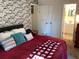 King-size bedroom with brick feature wall at 1111 South St, Eustis, FL 32726