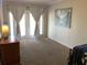 Bedroom with double doors leading to outside and accent lighting at 1111 South St, Eustis, FL 32726