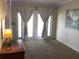 Bedroom with double doors leading to outside and accent lighting at 1111 South St, Eustis, FL 32726
