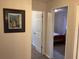 Hallway with view of two bedrooms at 1111 South St, Eustis, FL 32726