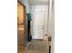 Hallway with access to exterior and laundry at 1111 South St, Eustis, FL 32726