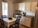 Bright kitchen with ample cabinetry, stainless steel appliances, and a breakfast nook at 1111 South St, Eustis, FL 32726