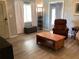 Comfortable living room showcasing a coffee table and recliner at 1111 South St, Eustis, FL 32726