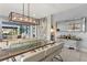 Elegant dining room with modern chandelier and artwork at 13219 Stanthorne Ave, Orlando, FL 32832