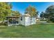 Rear view of a white single story home with covered patio at 1405 Rose Blvd, Orlando, FL 32839