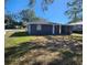 House with large backyard, mature trees, and great curb appeal at 1503 33Rd Nw St, Winter Haven, FL 33881