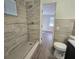 Bathroom with a walk-in shower and tile surround at 1503 33Rd Nw St, Winter Haven, FL 33881