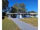 Newly renovated blue house with a landscaped front yard at 1503 33Rd Nw St, Winter Haven, FL 33881
