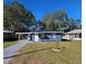 Newly renovated blue house with a landscaped front yard at 1503 33Rd Nw St, Winter Haven, FL 33881