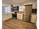 Modern kitchen featuring stainless steel appliances and white cabinetry at 1503 33Rd Nw St, Winter Haven, FL 33881