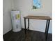 Interior of storage unit with water heater and workbench at 1503 33Rd Nw St, Winter Haven, FL 33881