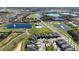 Community overview featuring a golf course, lakes, and homes at 16230 Trinidad Way, Clermont, FL 34714