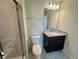 Clean bathroom with shower, toilet and vanity at 16230 Trinidad Way, Clermont, FL 34714