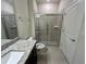 Modern bathroom with shower and granite vanity at 16230 Trinidad Way, Clermont, FL 34714