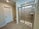 Bathroom with shower stall, toilet and tile flooring at 16230 Trinidad Way, Clermont, FL 34714