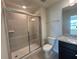 Modern bathroom featuring a shower and vanity at 16230 Trinidad Way, Clermont, FL 34714