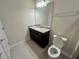 Bathroom features granite countertop and toilet at 16230 Trinidad Way, Clermont, FL 34714