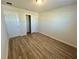 Bedroom with wood-look floors, closet and neutral walls at 16230 Trinidad Way, Clermont, FL 34714