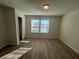 Spacious bedroom featuring wood-look floors and double closets at 16230 Trinidad Way, Clermont, FL 34714