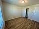 Bright bedroom with wood-look floors and a window at 16230 Trinidad Way, Clermont, FL 34714