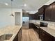 Modern kitchen with granite countertops and stainless steel appliances at 16230 Trinidad Way, Clermont, FL 34714