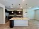Modern kitchen with granite countertops and stainless steel appliances at 16230 Trinidad Way, Clermont, FL 34714