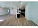 Open concept living area with wood-look floors at 16230 Trinidad Way, Clermont, FL 34714