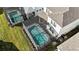 Two screened-in pools are situated in a backyard setting at 16230 Trinidad Way, Clermont, FL 34714