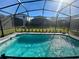 Relaxing screened-in pool in backyard at 16230 Trinidad Way, Clermont, FL 34714