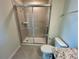 Large shower with glass enclosure and tile surround at 16230 Trinidad Way, Clermont, FL 34714