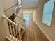 Elegant staircase leading to the second floor at 16230 Trinidad Way, Clermont, FL 34714