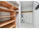 Laundry room with built-in shelving and a water heater at 2141 Camellia Dr, Longwood, FL 32779