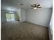 Spacious living room with carpeted floors and ceiling fan at 2355 Cypress Rd, Deland, FL 32724