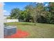 Spacious backyard with grassy area and tree at 3207 Stratton Cir, Kissimmee, FL 34744