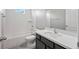 Clean bathroom with a bathtub, toilet, and dark brown vanity at 3207 Stratton Cir, Kissimmee, FL 34744