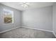 Spacious bedroom with a window and ceiling fan at 3207 Stratton Cir, Kissimmee, FL 34744
