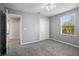 Bedroom with grey carpet, ceiling fan and window blinds at 3207 Stratton Cir, Kissimmee, FL 34744