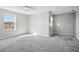 Bright bedroom with carpeted floor, large window, and neutral walls at 3207 Stratton Cir, Kissimmee, FL 34744