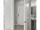 Clean entryway with tile flooring, leading to laundry and bathroom at 3207 Stratton Cir, Kissimmee, FL 34744