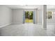 Gathering room with tile floors and sliding glass doors to backyard at 3207 Stratton Cir, Kissimmee, FL 34744