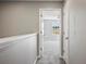 Upstairs hallway with carpet and access to bedrooms at 3207 Stratton Cir, Kissimmee, FL 34744