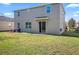 Two-story house with backyard and patio at 3207 Stratton Cir, Kissimmee, FL 34744
